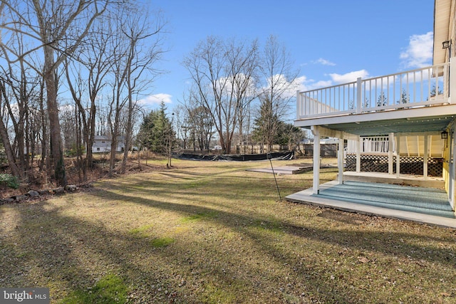 view of yard featuring a wooden deck