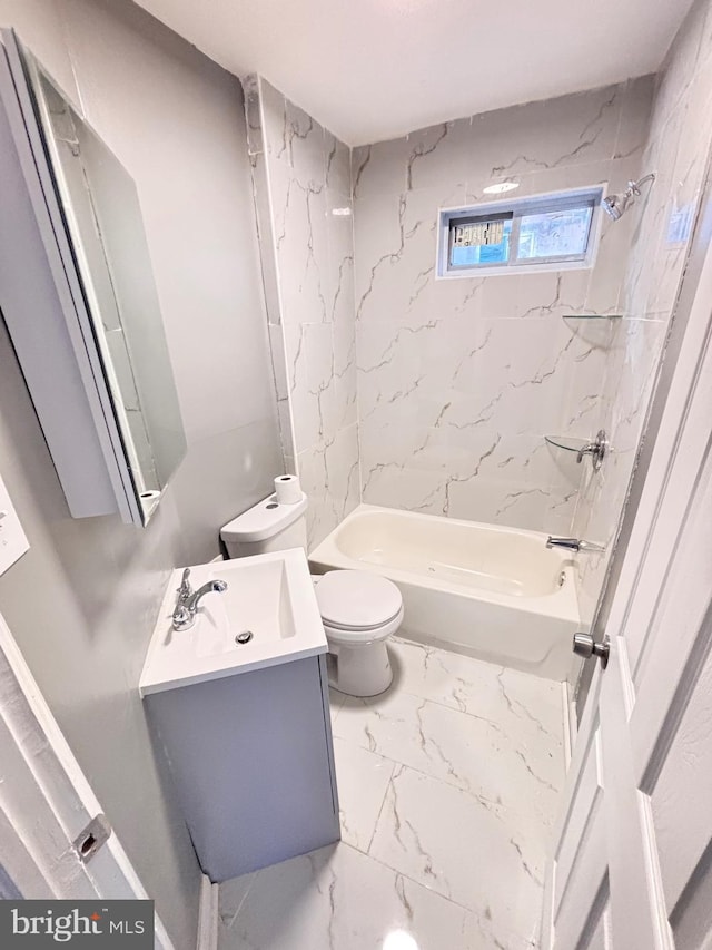 full bathroom featuring tiled shower / bath combo, toilet, and vanity