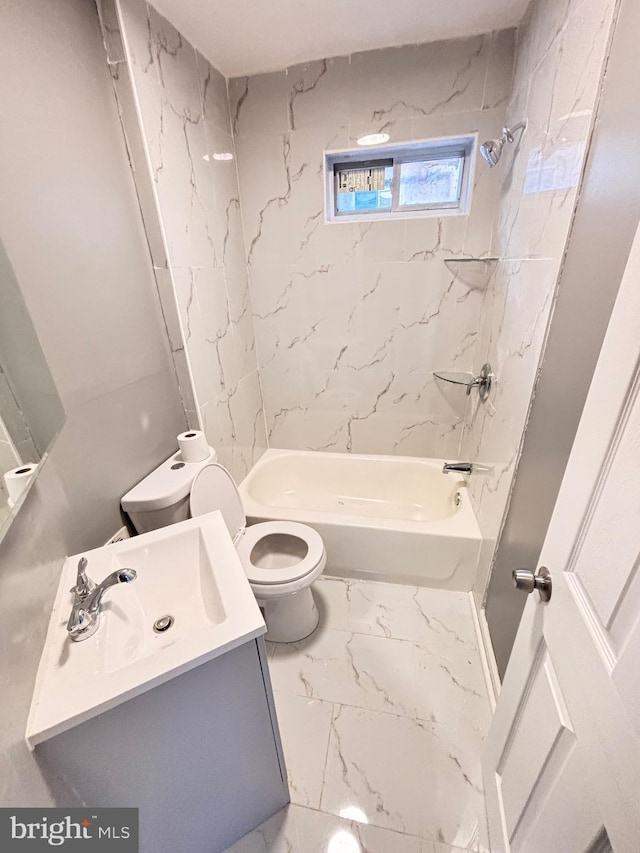 full bathroom with tiled shower / bath combo, toilet, and vanity