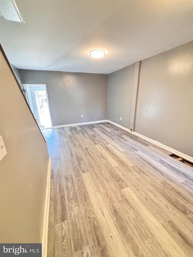 spare room featuring hardwood / wood-style flooring