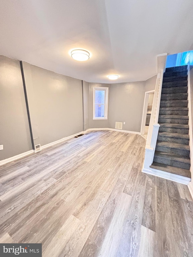 basement with wood-type flooring