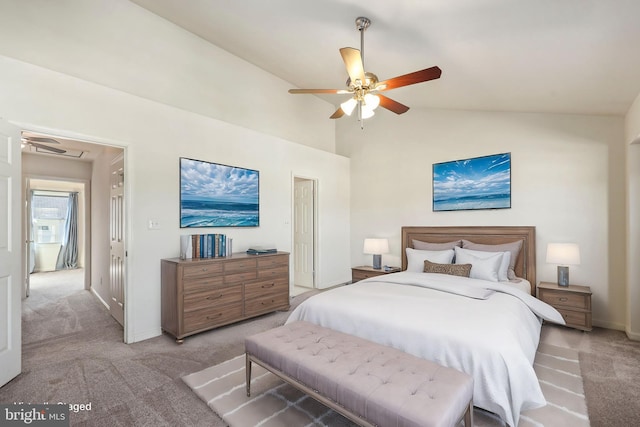 bedroom featuring ceiling fan, light colored carpet, and vaulted ceiling