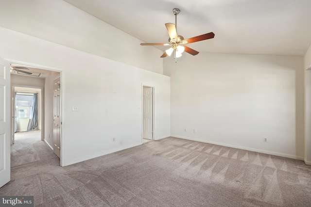 spare room with high vaulted ceiling, light colored carpet, and ceiling fan