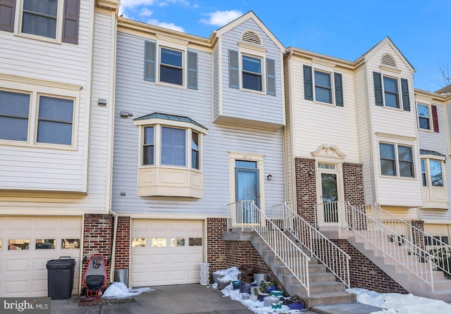 townhome / multi-family property featuring a garage