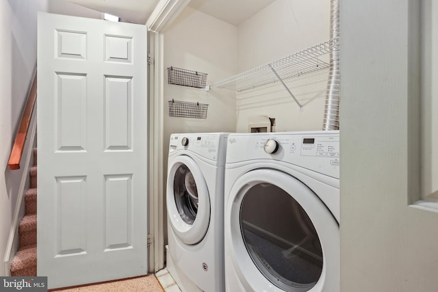 laundry area with separate washer and dryer