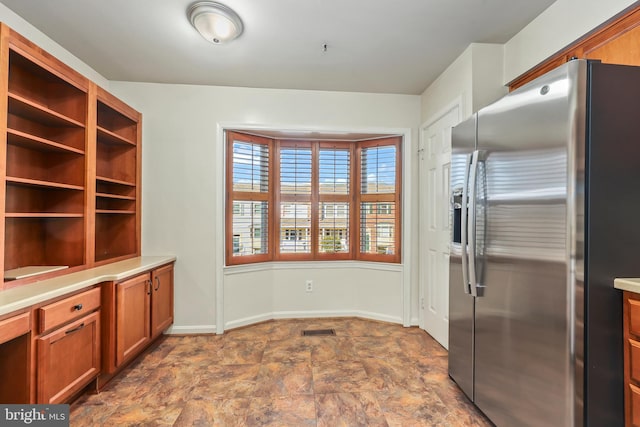 kitchen featuring stainless steel fridge