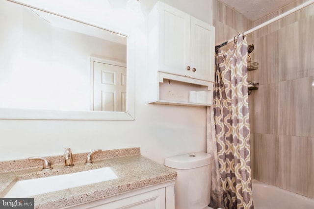 full bathroom featuring vanity, shower / bath combo, and toilet