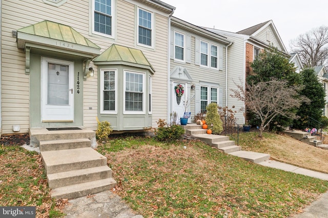 view of property featuring a front yard