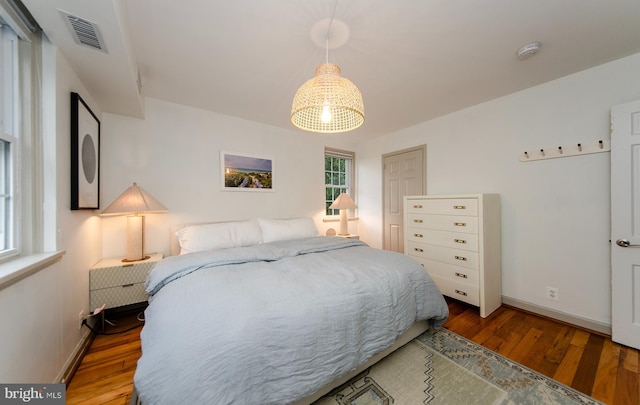 bedroom with hardwood / wood-style floors