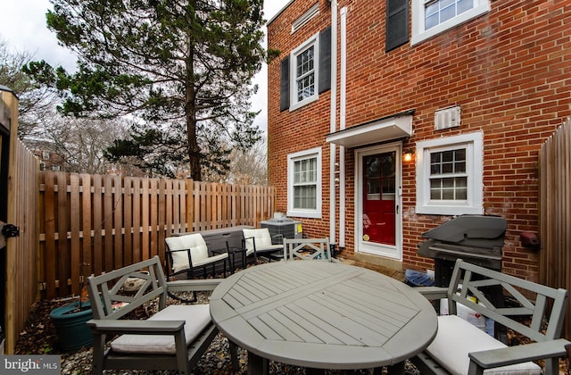 view of patio / terrace featuring area for grilling and central air condition unit