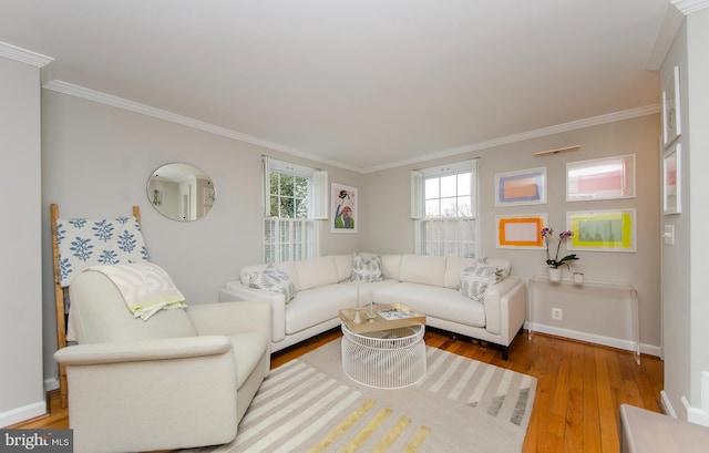 living room featuring light hardwood / wood-style flooring and ornamental molding