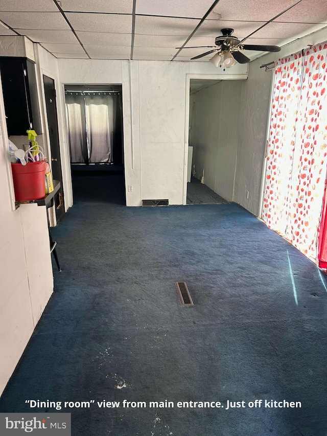 76 Jackson St, Conemaugh, PA 15909 - carpeted empty room with a ceiling fan and a drop ceiling