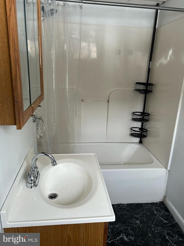 bathroom featuring vanity and shower / bath combo with shower curtain