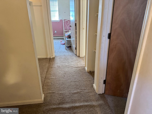 corridor with light colored carpet and baseboard heating