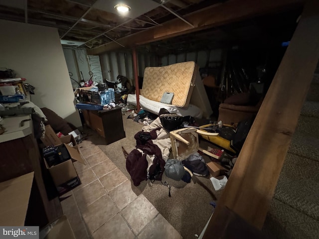 basement featuring tile patterned floors