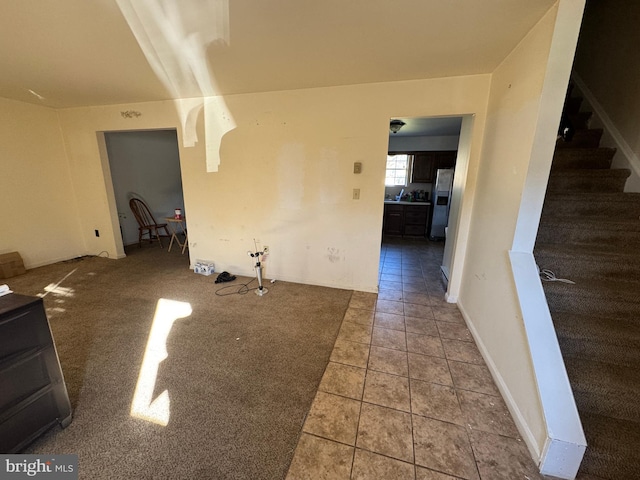 unfurnished living room featuring carpet floors