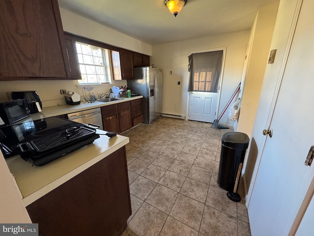 kitchen with stainless steel fridge, dark brown cabinetry, sink, a baseboard radiator, and dishwasher