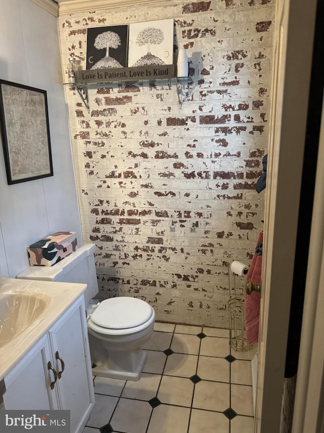 bathroom with tile patterned floors, vanity, and toilet