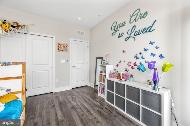 bedroom featuring dark wood-type flooring