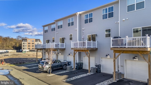 exterior space with a balcony and cooling unit