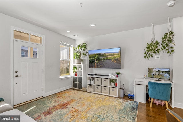 living room with dark hardwood / wood-style flooring