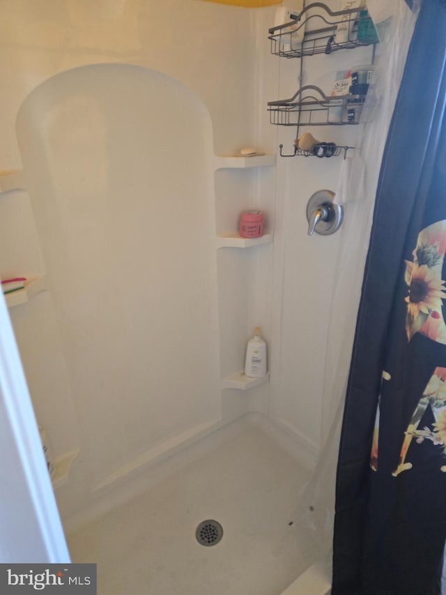 bathroom featuring walk in shower