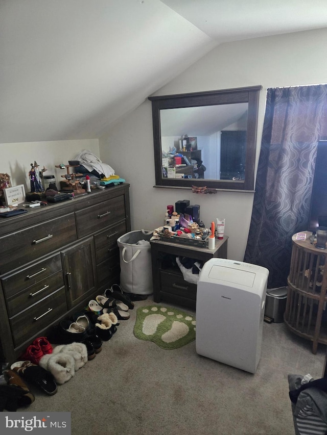 additional living space featuring vaulted ceiling and light carpet