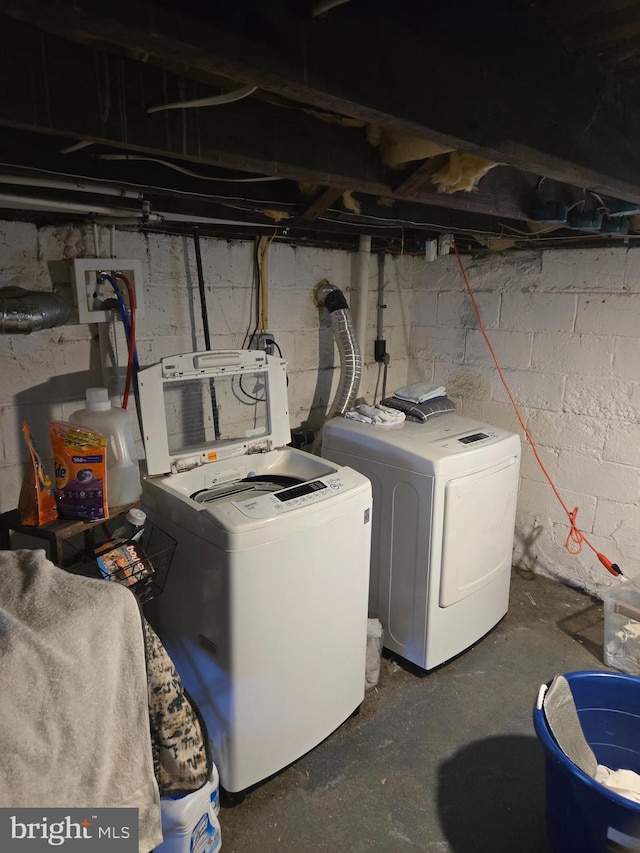 washroom with independent washer and dryer