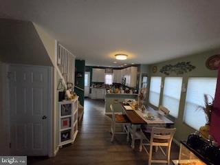 dining area with dark hardwood / wood-style floors