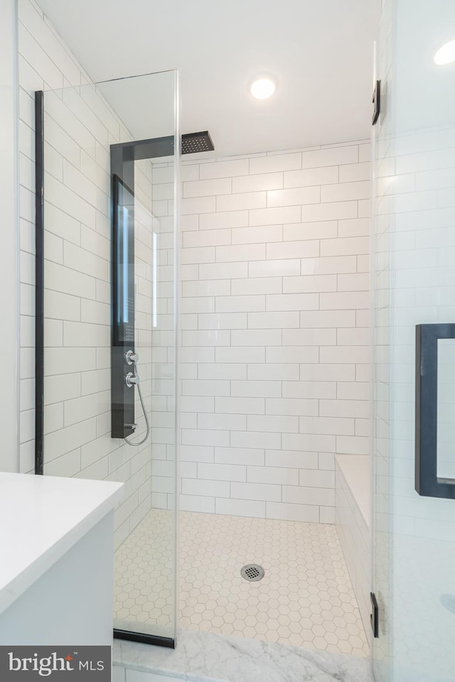 bathroom with vanity and walk in shower