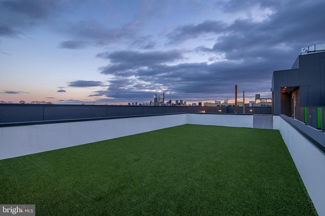 view of yard at dusk