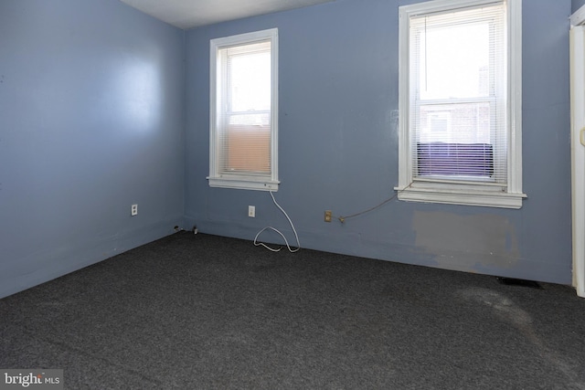1137 Sycamore St, Camden, NJ 08103 - unfurnished room featuring dark colored carpet