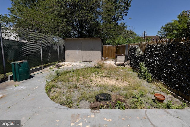 1137 Sycamore St, Camden, NJ 08103 - fenced backyard with a storage shed and an outbuilding