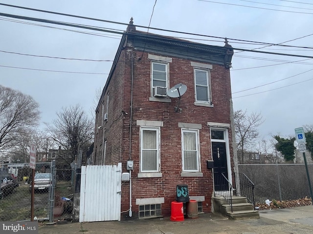 view of front of home with cooling unit