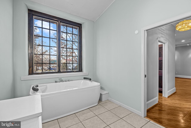 bathroom featuring tile patterned floors and a healthy amount of sunlight