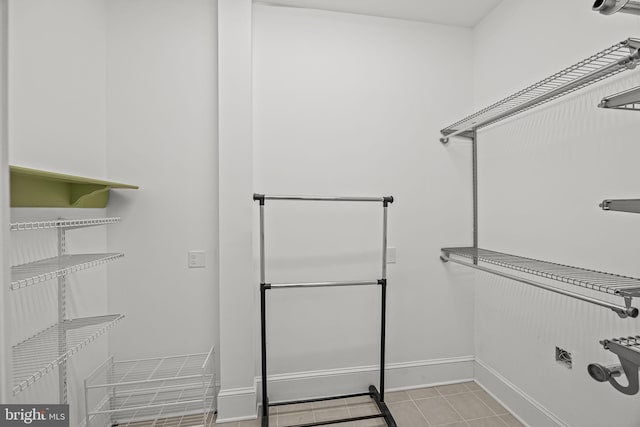 spacious closet featuring light tile patterned floors