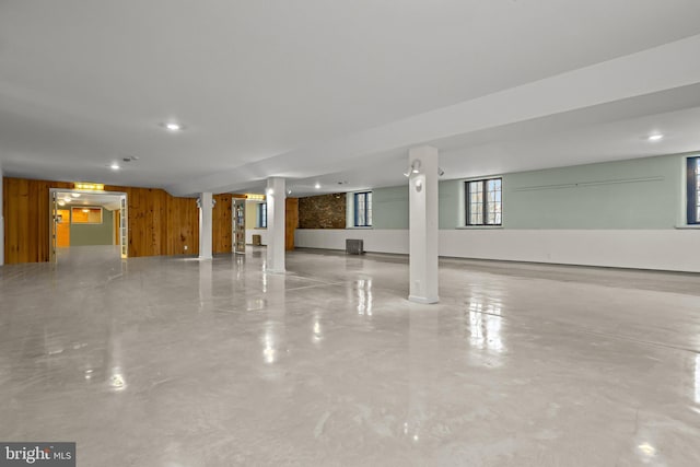 interior space featuring wooden walls