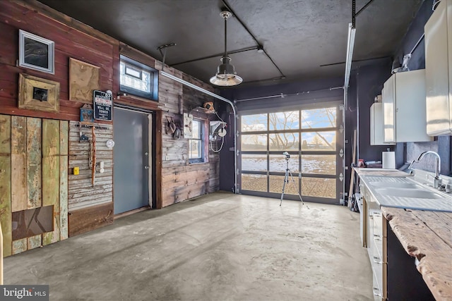 garage with wooden walls and sink