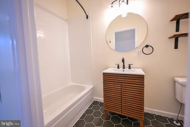 full bathroom featuring tile patterned floors, vanity, toilet, and bathing tub / shower combination