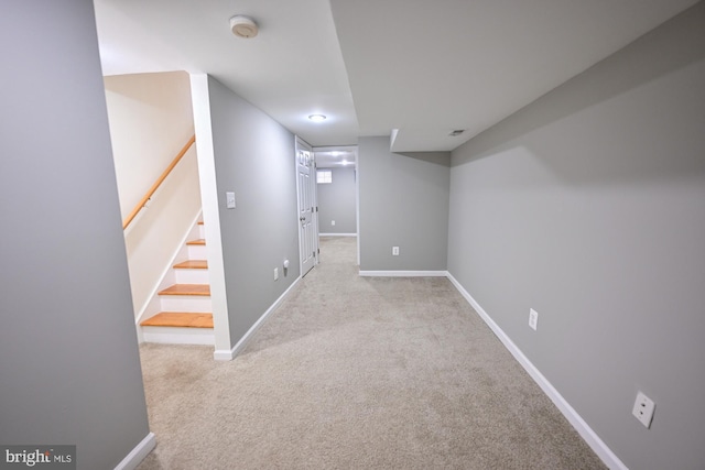 basement with light colored carpet