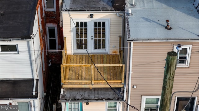 view of side of property featuring french doors