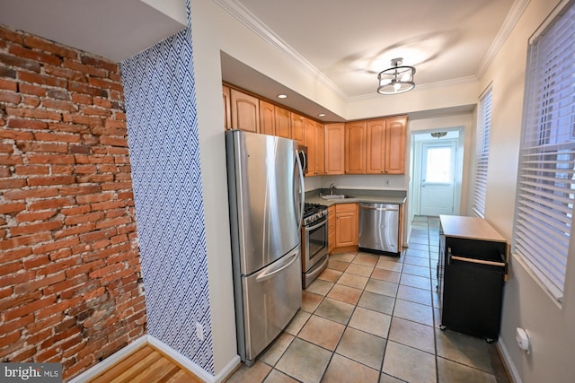 kitchen featuring crown molding, sink, light tile patterned floors, and appliances with stainless steel finishes