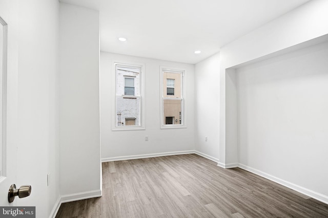 spare room with light hardwood / wood-style floors