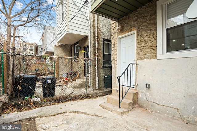 doorway to property with central air condition unit