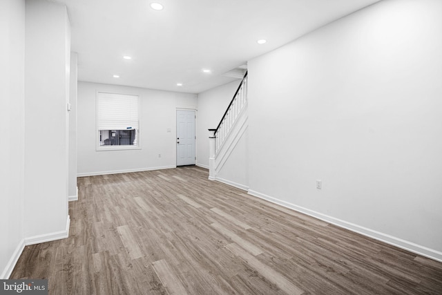 unfurnished living room featuring light hardwood / wood-style flooring