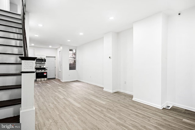 unfurnished living room featuring light wood-type flooring