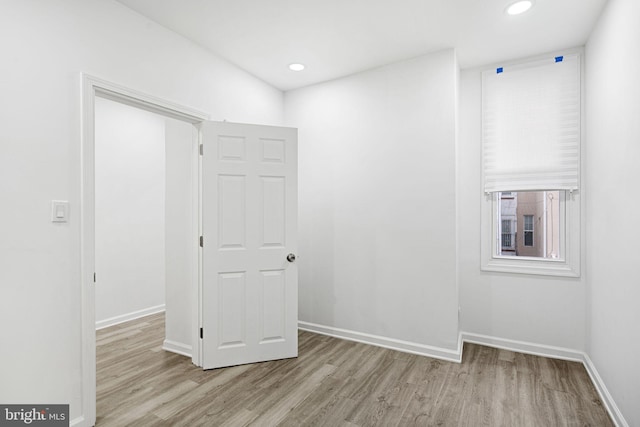 unfurnished room with light hardwood / wood-style floors