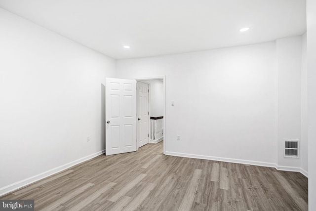 spare room featuring light hardwood / wood-style floors