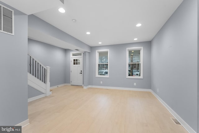 foyer with light hardwood / wood-style floors