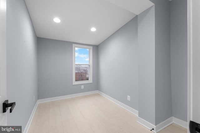 unfurnished room with light wood-type flooring